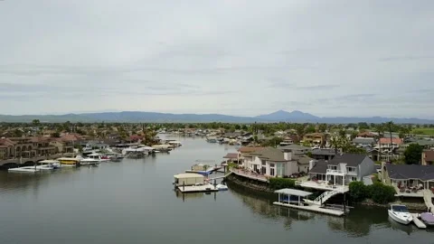 Drone Over Waterfront Neighborhood With Distant Mountain (1 of 2) Stockbeeldmateriaal 166319519