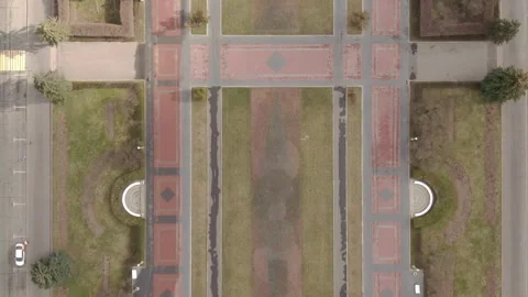 Drone overhead glide above geometric park layout Vidéo 324677390