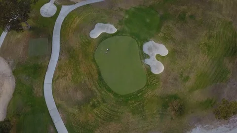 Drone Overhead golf course looking down on 2 holes flying slow forward Stock Footage 116523777
