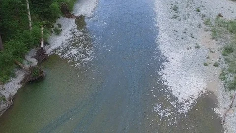 Drone Overhead Push Back Man Walking Along River  Video stock 92174957