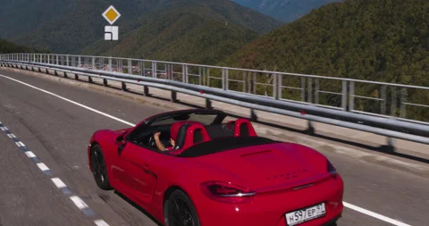 Drone Overhead Red Convertible Driving Countryside Scene Stock Footage 160269862
