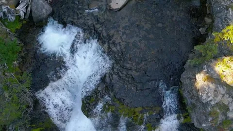 Drone overhead tracking shot  reveals a waterfall Stock Footage 318476991