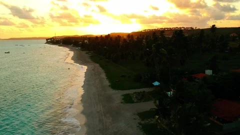 Drone overhead view of golden sunset on blue beach Stock Footage 133207860