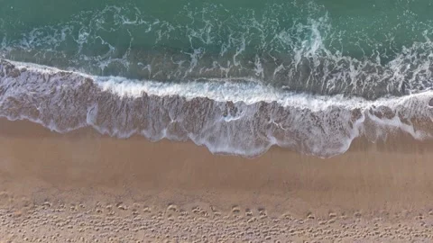 Drone Overhead View of Ocean Waves Crashing on Sandy Shore Stock Footage 320930802