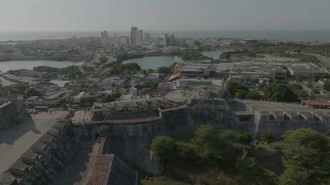 Drone overlooking the small house in the castillo san felipe in cartagena Stock Footage 329282093