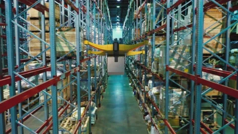 Drone with a package on a board flying inside warehouse. Delivery future concept Video stock 149456607