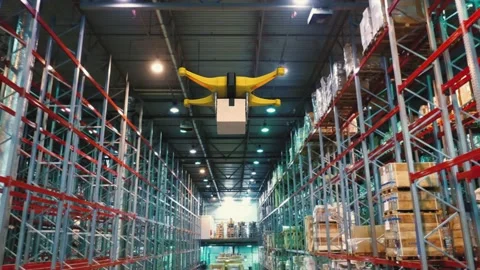 Drone with a package on a board flying inside warehouse. Delivery future concept Stock Footage 149456827