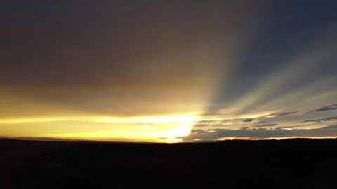 Drone pan across bright sunset Stock Footage 310575219