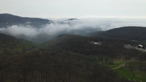 Drone: Pan across cloudy Blue Ridge Mountains Stock Footage 205520008