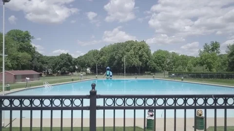 Drone Pan across large Swimming Pool Stock Footage 76807356