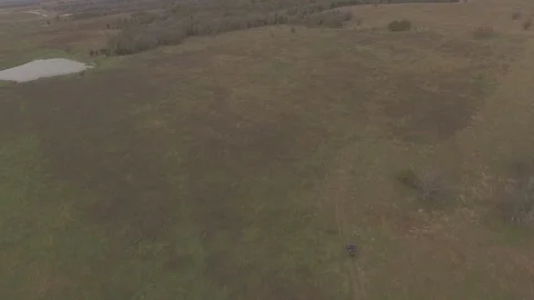 Drone Pan Up ATV in Field  Stock Footage 92421070