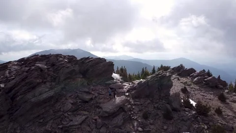 Drone pan away from mountain on cloudy day Stock Footage 133144938