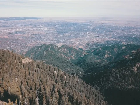 Drone pan from city to mountains Video stock 84340187