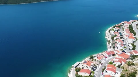 Drone Pan from Coastal Accommodation to View of Peljesac Bridge Stock Footage 313061405