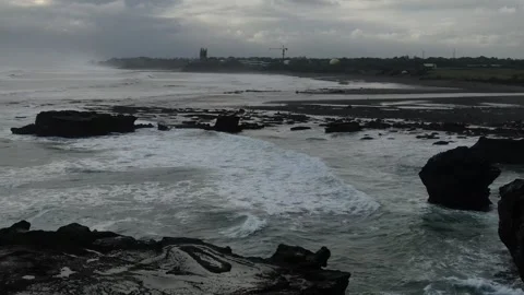 Drone pan down towards wave ocean rocks Vidéo 303639034