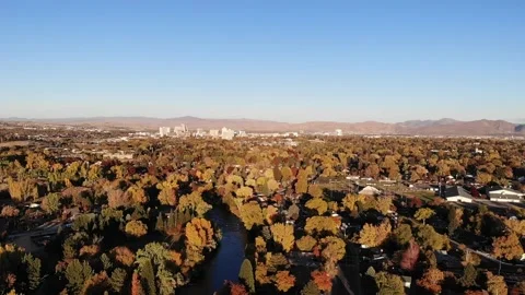 Drone pan left over caughlin ranch valley full of fall color with Reno in th Stock Footage 143607447