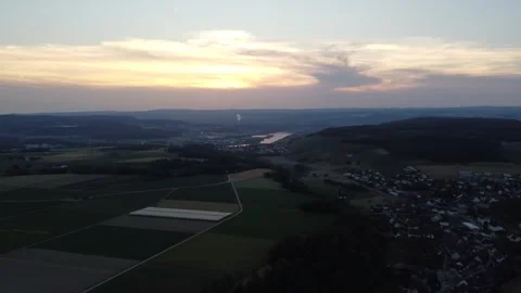 Drone Pan Left Over Tegerfelden At Sunset With Aare River 스톡 동영상 337929380