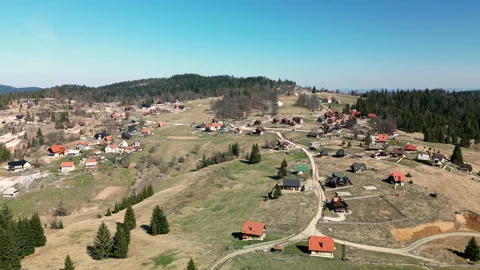 Drone pan left to right over Tara Mountain village and countryside, Serbia Stock Footage 328234968