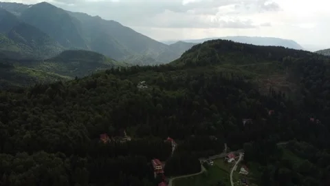 Drone pan motion with mountain peak with forest area Stock Footage 297254992
