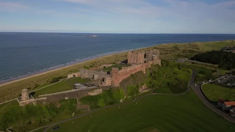 Drone Pan Orbit View Ancient Castle in Northumberland at Sunset 스톡 동영상 281089348
