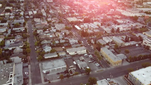 Drone: Pan Up over Los Angeles at Sunrise with Lens Flare Stock Footage 146351387