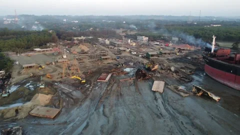Drone Pan Over Shipbreaking Yard Showing Heavy Machinery and Industrial Activity Stock Footage 327442212