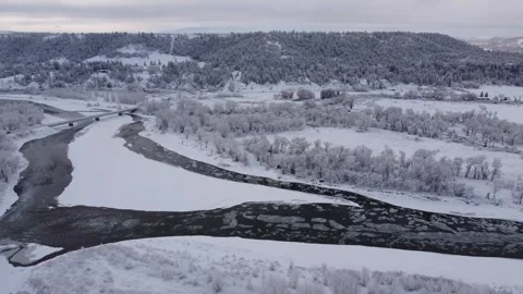 Drone pan over small town and river in winter Stock Footage 310576222