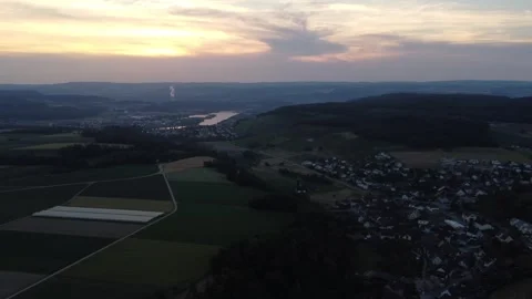 Drone Pan Over Tegerfelden At Sunset With Aare River Stock-Footage 337928865