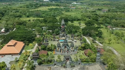 Drone pan shot around big Hindu temple in Negara, Bali during Galungan Video stock 114352819