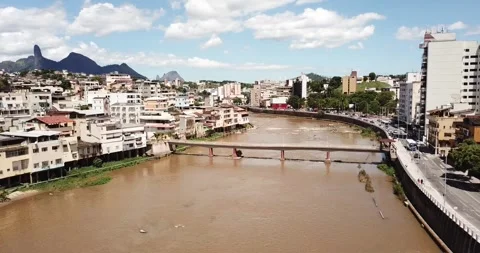 Drone pan shot of Cachoeiro do Itapemirim city and Itapemirim River, ES Stock Footage 317733826