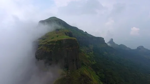 Drone pan shot of mountain ranges and lush green forest of India Stock Footage 117699856