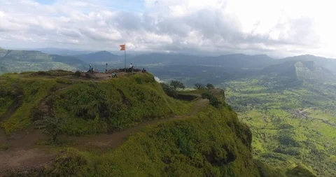 Drone pan shot of mountain top with ancient structure and water tank Stock Footage 117423554
