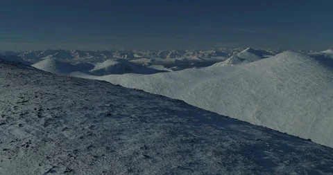 Drone pan on snow covered mountain top. 4K 50p 스톡 동영상 88115820