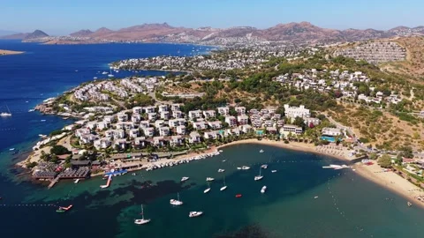 Drone panning around luxury high end holiday villas in Bitez Bodrum along the Stock Footage 345814701