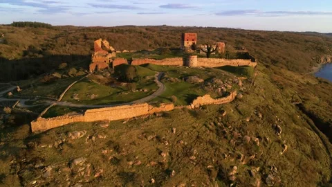 Drone panning around medieval castle ruin of Hammershus in Denmark Stock Footage 314213640