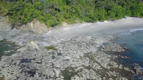Drone panning left to right down shoreline of Playa Prieta Stock Footage 91183191
