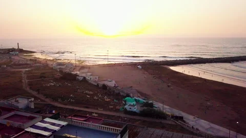 Drone Panning Over Beachfront Rooftops At Sunset In Morocco Stock Footage 346742702