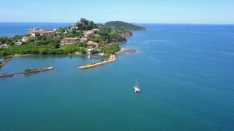 Drone panning right to left over Playa Flamingo bay Stock Footage 90968787