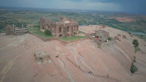Drone panning shot of built structure on rocky mountain Stock Footage 122399670