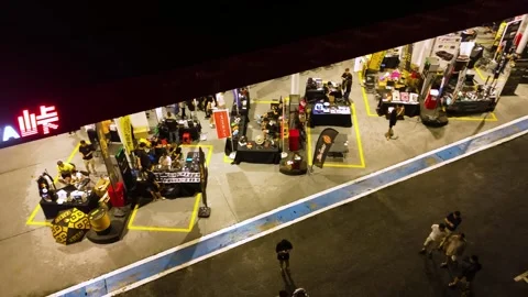 A drone panning view of a vibrant car tuning event in Kuala Lumpur. Malaysia Stock Footage 307494634