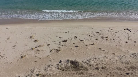 Drone panorama of empty beach shore with clear water Stock Footage 328571926