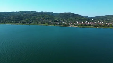 Drone Panorama of Forested Coastline and Blue Sea Stock Footage 342345603