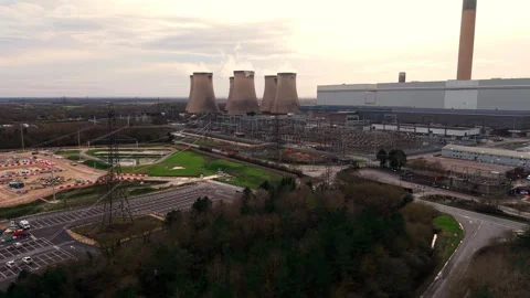 Drone panorama of a massive biomass power station and cooling tower array at 動画素材 339047489