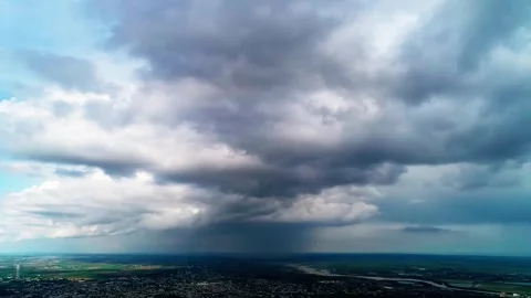 Drone panorama over small town under dramatic summer clouds Stock Footage 346801942