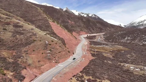 Drone panorama of remote mountain road and highland terrain in China Stock Footage 337893962