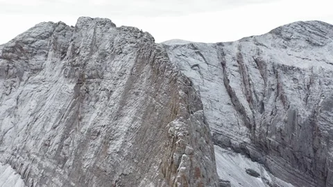 Drone panorama rising above the Throne of Zeus Peak, unveiling snow covered Stock Footage 331240193