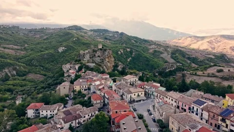 Drone panorama of Roccascalegna castle overlooking a historic village, green Stock Footage 324683756
