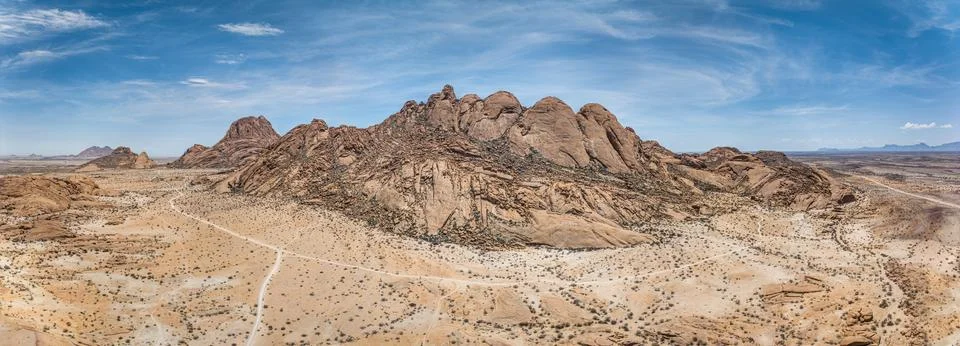 Drone panorama of the Spitzkoppe in Namibia during the day against a blue sky Stock-Fotos