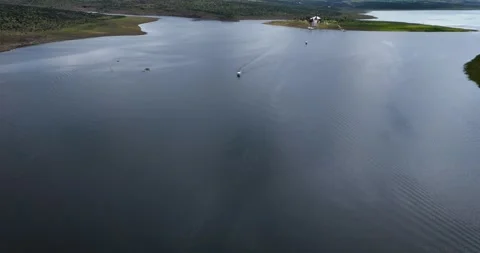 Drone panoramic and close-up midday of Cristo Roto island over Presa Calles Stock Footage 318293988
