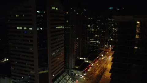 Drone, panoramic and zoom view of a downtown district with lit up streets Stock-Footage 240729492